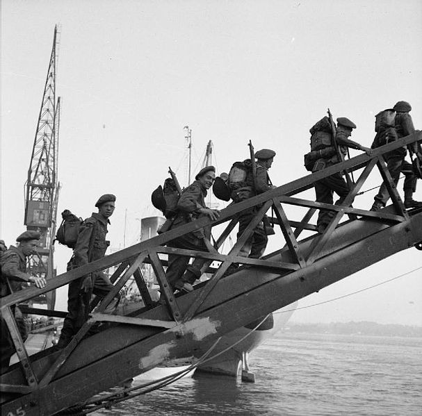 British troops walking up the gangway of SS Empire Lance from Southampton on the way to France. (June 1944). Source: Imperial War Museums,  B 5237.