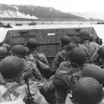 Troops in a landing craft approaching Omaha Beach. (June 6, 1944). Source: U.S. National Archives, # SC 320901.