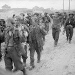 German prisoners being brought in by men of the 13th/18th Hussars in Lion-sur-Mer on D-Day. Source: Imperial War Museums,  B 5079.