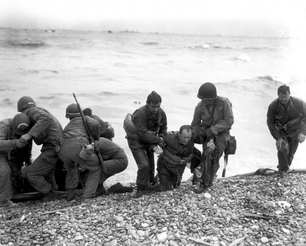 American landing party helping out on Omaha Beach, France. (June 6, 1944). Source: Center of Military History.