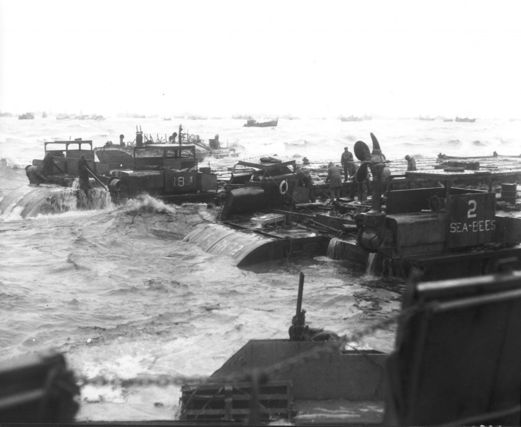 Three rhino barges and a petrol barge on the coast. Source: Center of Military History.
