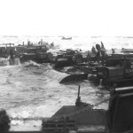 Three rhino barges and a petrol barge on the coast. Source: Center of Military History.
