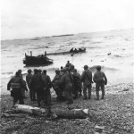 G.I.s helping other Americans get to shore. (June 12, 1944). Source: Center of Military. History.