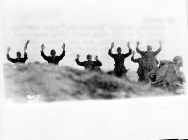 German troops surrender to Soldiers during the Allied Invasion of Europe on D-Day. (June 6, 1944). Source: Army.mil.