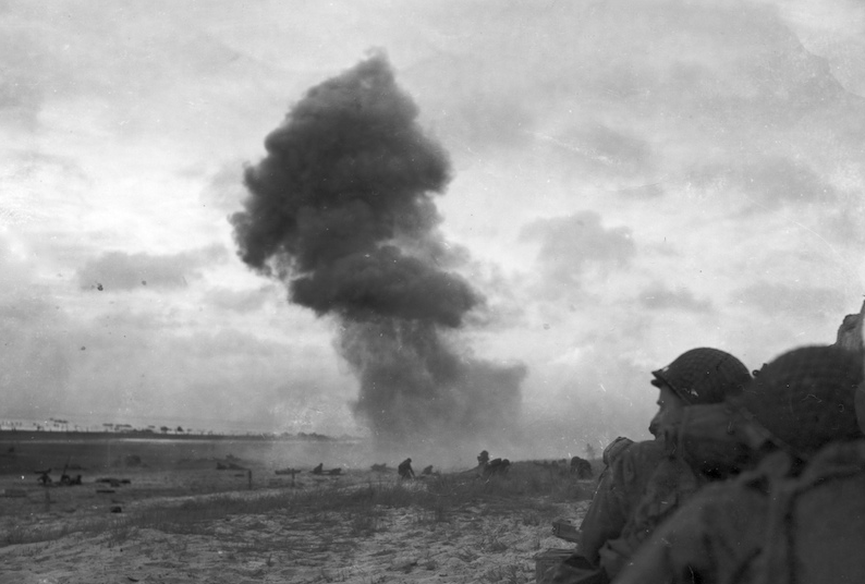 Nazi 88mm guns pound Utah Beach as American troops push into Normandy, France. (June 11, 1944).  Source: U.S. National Archives, # 111-SC-190109.