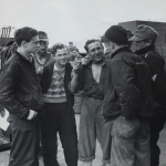 Nazi prisoners chat with Coast Guardsmen aboard a LCI which is transporting them from the French coast to a war prisoner's camp in England. The Coast Guardsmen are (from left to right): Allen Aylward and Harold Goodwin (back to camera). Source: U.S. National Archives, # 26-G-2447.