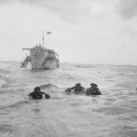 Troops wading ashore from an LCI(L) on Queen beach, Sword area. (June 6, 1944). Source: Imperial War Museums,  B 5092.