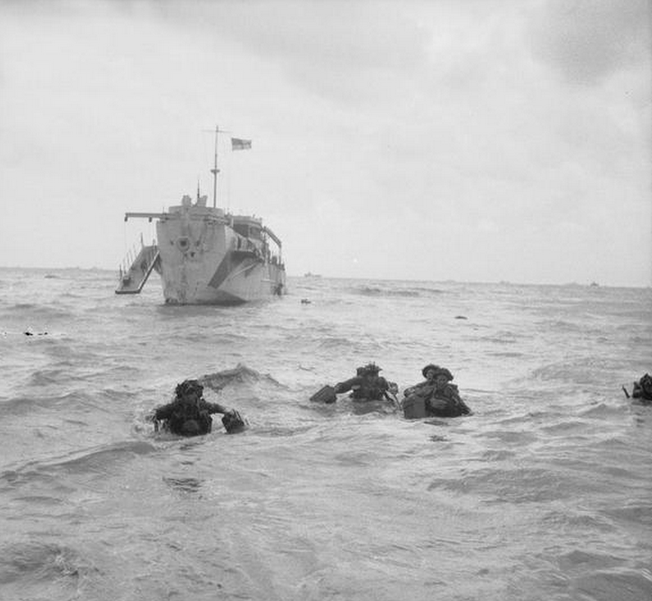 Troops wading ashore from an LCI(L) on Queen beach, Sword area. (June 6, 1944). Source: Imperial War Museums,  B 5092.
