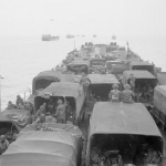 Vehicles and men aboard LST 406 with other landing craft during the passage to Normandy. (June 6, 1944). Source: Imperial War Museums, B 5160.