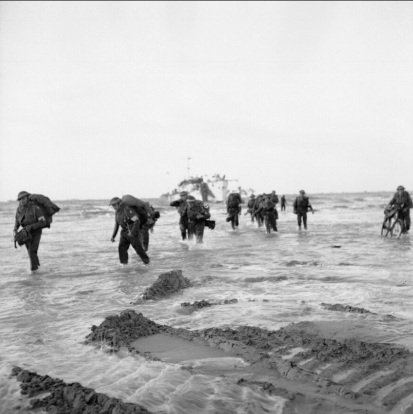 Follow-up troops wade ashore from landing craft on Queen sector of Sword Beach. (June 7, 1944). Source: Imperial War Museums, # B 5008.