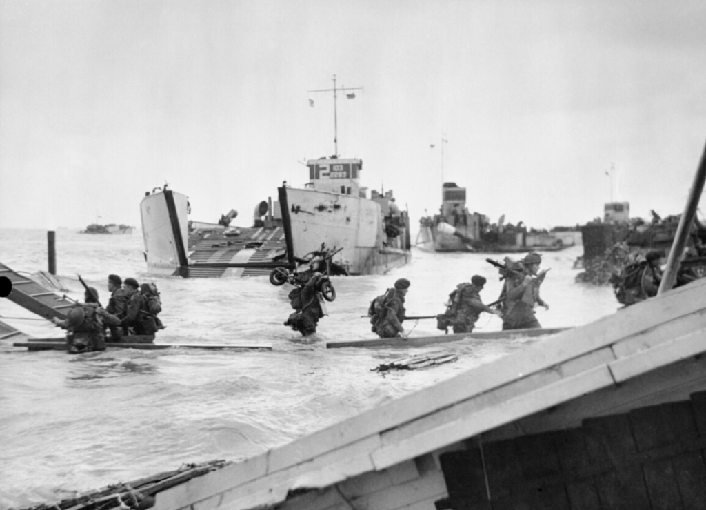 Commandos of 48 (RM) Commando coming ashore from landing craft at St Aubin-sur-Mer on Juno Beach. (June 6, 1944). Source: Imperial War Museums, # B 5217.