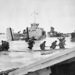 Commandos of 48 (RM) Commando coming ashore from landing craft at St Aubin-sur-Mer on Juno Beach. (June 6, 1944). Source: Imperial War Museums, # B 5217.
