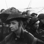 Film still showing commandos of No. 4 Commando, 1st Special Service Brigade, aboard a LCI(S) landing craft on their approach to Queen Red beach, Sword area. (June 6, 1944). Source: Imperial War Museums, # BU 1181.