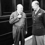 Winston Churchill shows off his famous "siren suit" to General Dwight D Eisenhower, during a tour of Allied invasion forces in Kent. (May 12, 1944). Source: Imperial War Museums, # H 38458.