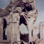 Two Nuns and a French family examined the ruins of the bombed Church of St. Malo, in Valognes, France. Near Cherbourg. (July 1944). Source: U.S. National Archives, # USA C-2172.