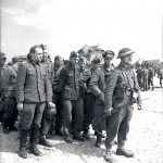 Two German officers in a group of prisoners who surrendered to the Canadians in Courseulles, Normandy, France. (June 6, 1944). Source: National Archives of Canada, # PA-114493, Photographer: Ken Bell.