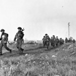 Troops of the Canadian Royal Winnipeg Rifles regiment marching in Normandy, France. (June 6, 1944). Source: National Archives of Canada, # PA-116528.