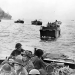 Troops of the Canadian Royal Winnipeg Rifles regiment approaching Juno Beach, Normandy, France aboard LCA landing craft. (June 6, 1944). Source: National Archives of Canada, # PA-132651.