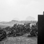 Men of the British 2nd Army waiting to move off Queen White Beach of Sword Beach, Normandy, France. (June 6, 1944). Source: Imperial War Museums, # 4700-29 B 5091, Photographer: J. Mapham.