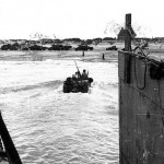 U.S. Army weapons carrier moved through the surf toward Utah Beach, Normandy, after being launched from its landing craft. (June 6, 1944). Source: U.S. National Archives, # SC 190438.