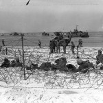 German prisoners of war in a barbed-wire enclosure on Utah Beach, Normandy. (June 6, 1944). Source: U.S. National Archives, # SC 320897.