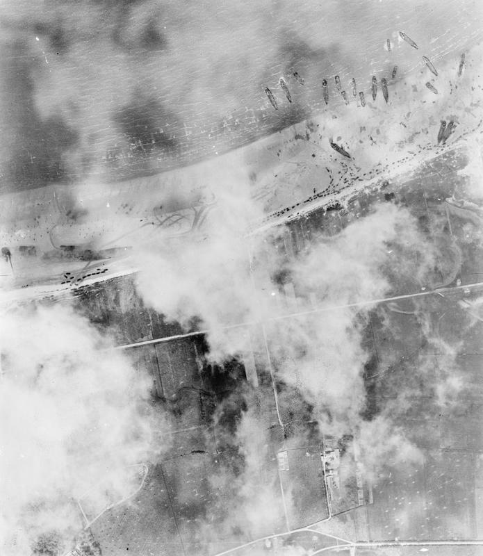 Vertical aerial photograph of the landings on Mike beach, Juno area, to the west of Courselles-sur-Mer. (June 6, 1944). Source: Imperial War Museums, # CL 41.