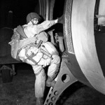 A paratrooper boards an airplane that will drop him over the coast of Normandy for D-Day. (June 6, 1944). Source: Army.mil.