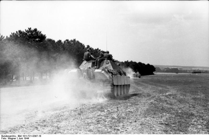 German Jagdpanther tank destroyer traveling across a field in France during the Allied invasion. (June 1944). Source: German Federal Archive, Bild 101I-721-0397-18.