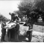 German troops transporting a wounded soldier with a SdKfz. 251 halftrack vehicle. Eastern Front. (June 21, 1944). Source: German Federal Archive, #Bild 101I-695-0401-17A.