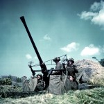Canadian soldiers manning a 40-mm Bofors anti-aircraft gun in Normandy, France. (June 1944). Source: World War II Database.