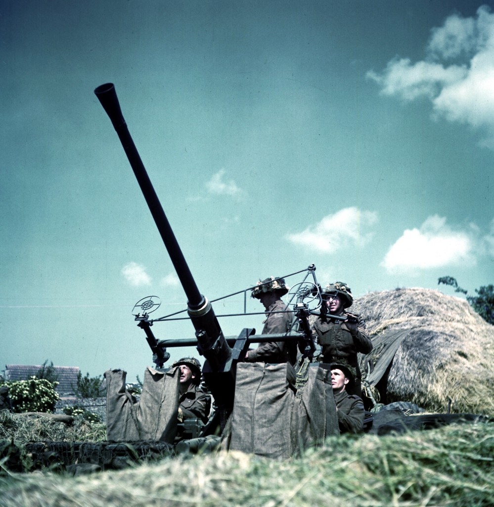 Canadian soldiers manning a 40-mm Bofors anti-aircraft gun in Normandy, France. (June 1944). Source: World War II Database.