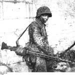 German soldier with MG42 machine gun. Caen, France. (June 1944). Source: German Federal Archive, Bild 146-1983-109-14A.