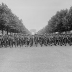American troops of the 28th Infantry Division march down the Champs Elysees, Paris, in the 'Victory' Parade.' (August 29, 1944). Source: U.S. National Archives, # 111-SC-193197.