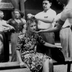 This girl pays the penalty for having had personal relations with the Germans. Here, in the Montelimar area, France, French civilians shave her head as punishment. (August 29, 1944). Source: U.S. National Archives, # 111-SC-193785.