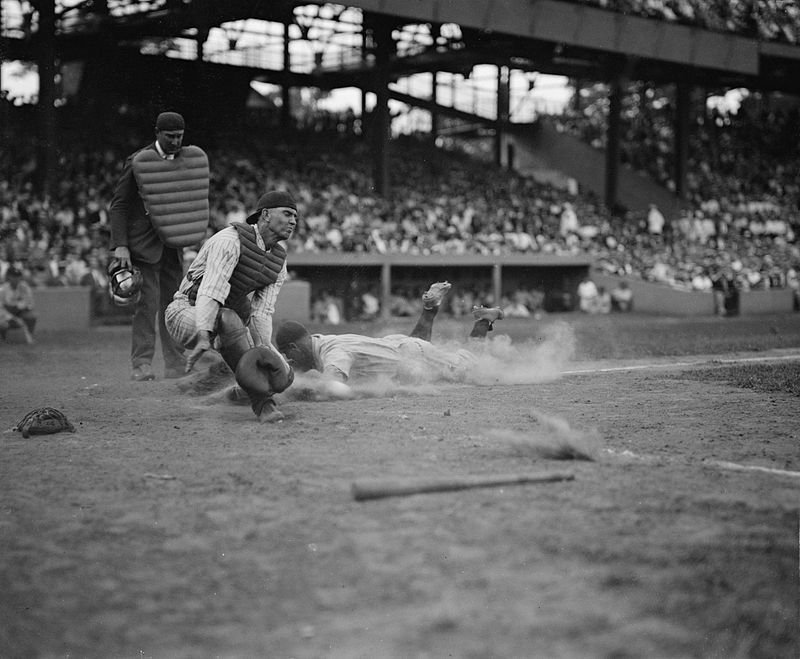Lou Gehrig slides into home plate to score a run in the fourth inning as the Yankees were playing the Washington Senators. The Yankees would go on to win that game 3-2. (1925). Source: Wikipedia.