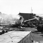 Wreckage of a North American P-51 which crashed while landing on Iwo Jima, Bonin Islands, after returning from a raid over Chichi Jima. The pilot, evidently, lost control of the wheels and the plane ploughed into tents, knocking a truck over and then burst into flames. The pilot died the next day. (April 7, 1945). Source: Mark, www.7thfighter.com.
