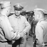 Shortly after their arrival on Iwo Jima, Bonin Islands, on an inspection tour, Lt. General Barney M. Giles (center) and Lt. General James Doolittle talk with personnel of the VII Fighter Command. (May 21, 1945). Source: Mark, www.7thfighter.com.
