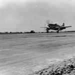One of the first planes to arrive at Iwo Jima, Bonin Islands - North American P-51 "Mustang" - comes in for a landing on the airstrip. (March 6, 1945). Source: Mark, www.7thfighter.com.