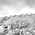 Marines of the 5th Division inch their way up a slope on Red Beach No. 1 toward Surbachi Yama as the smoke of the battle drifts about them. Dreyfuss, Iwo Jima. (February 19, 1945). Source: Creative Commons.