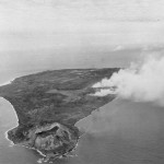 Iwo Jima during the pre-invasion bombardment--looking north with Mount Suribachi in the foreground. Photographed from an airplane, based on USS Makin Island (CVE-93). Source: Creative Commons.