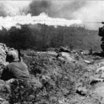 A Marine blasts a Japanese position on Iwo Jima with a flamethrower. Source: Department of Defense.
