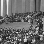 Military color guard on steps of Lincoln Memorial with audience, speakers & photographers on all sides. Photographed by Warren K. Leffler. (Aug. 28, 1963). Source: Library of Congress #LC-DIG-ds-04411.